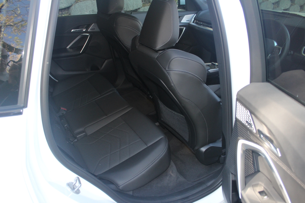 The BMW iX1's rear-seat space isn't as generous as the front occupants enjoy.