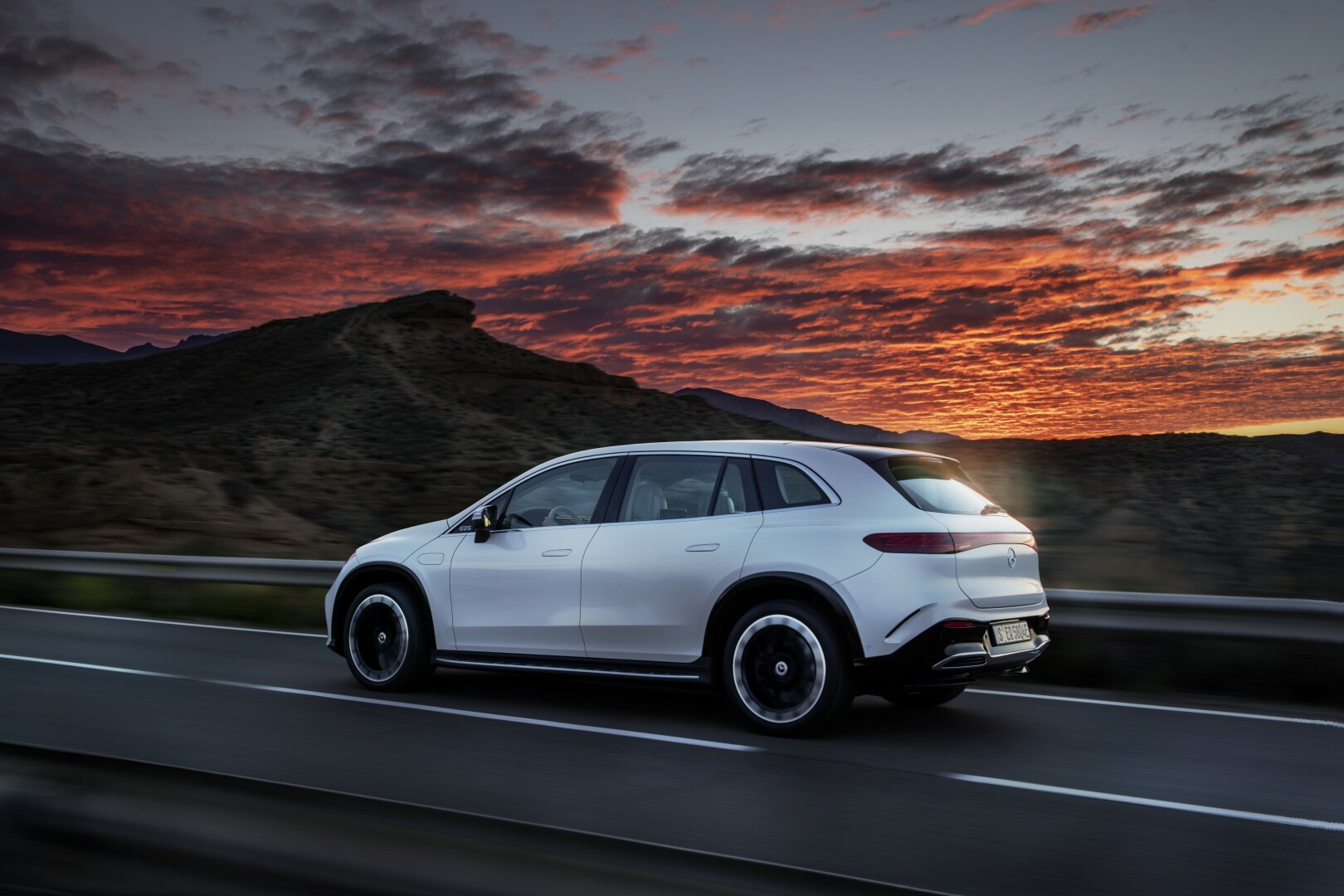 Mercedes-Benz EQS 450 sunset view on the road
