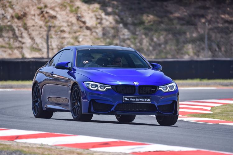 A blue BMW M3 Sport on the racetrack