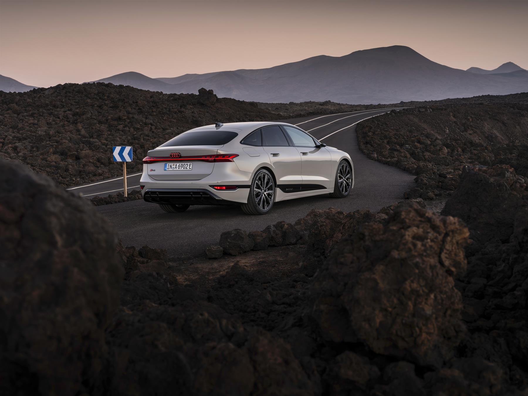 Audi A6 e-tron rear view on the road