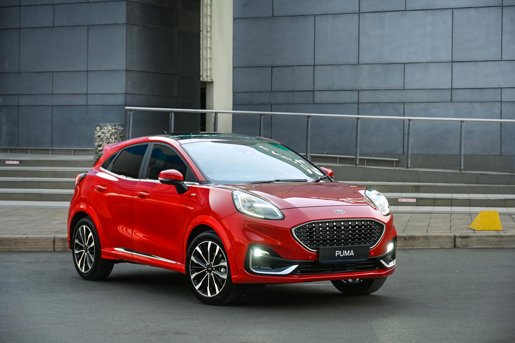 A red Ford Puma car