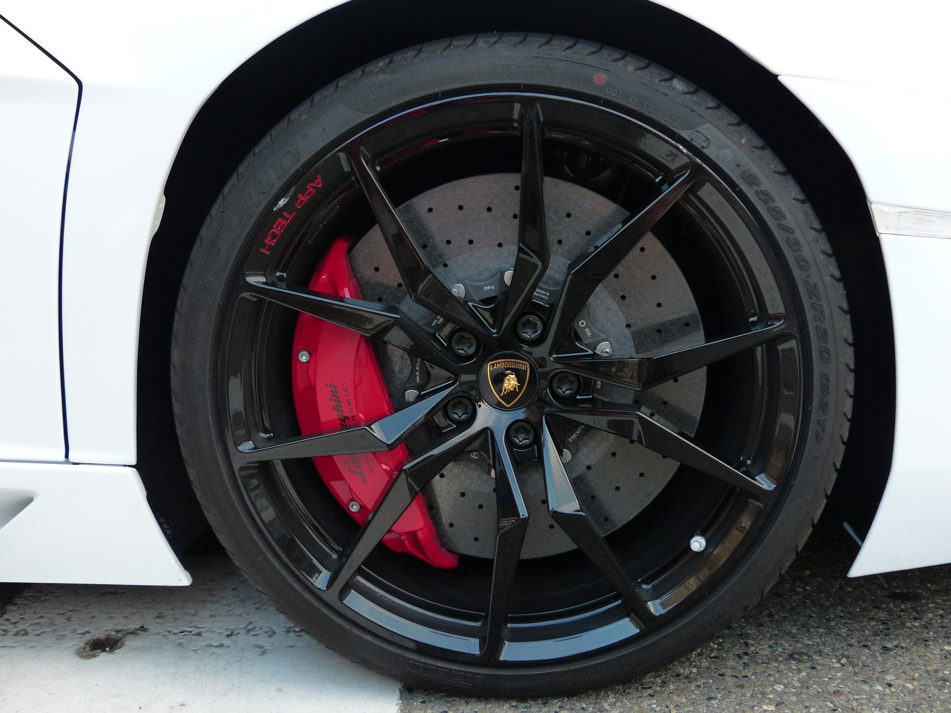 Close up of brake caliper through wheel