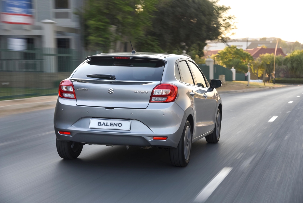 Silver Suzuki Baleno student car ont he road