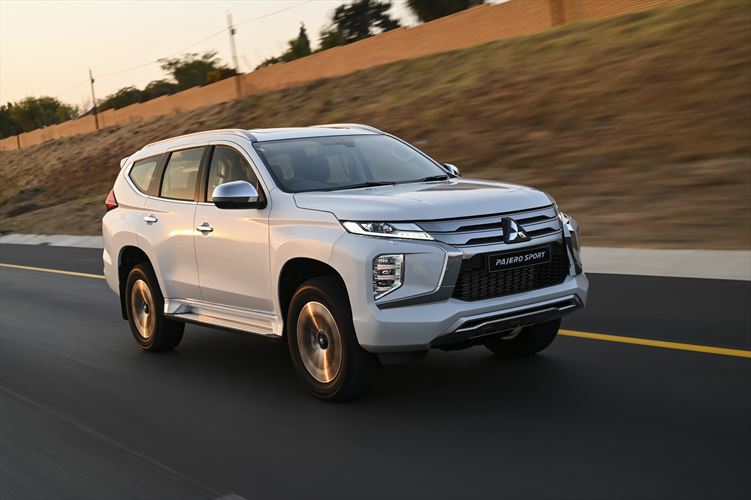 A white Mitsubishi Outlander SUV car