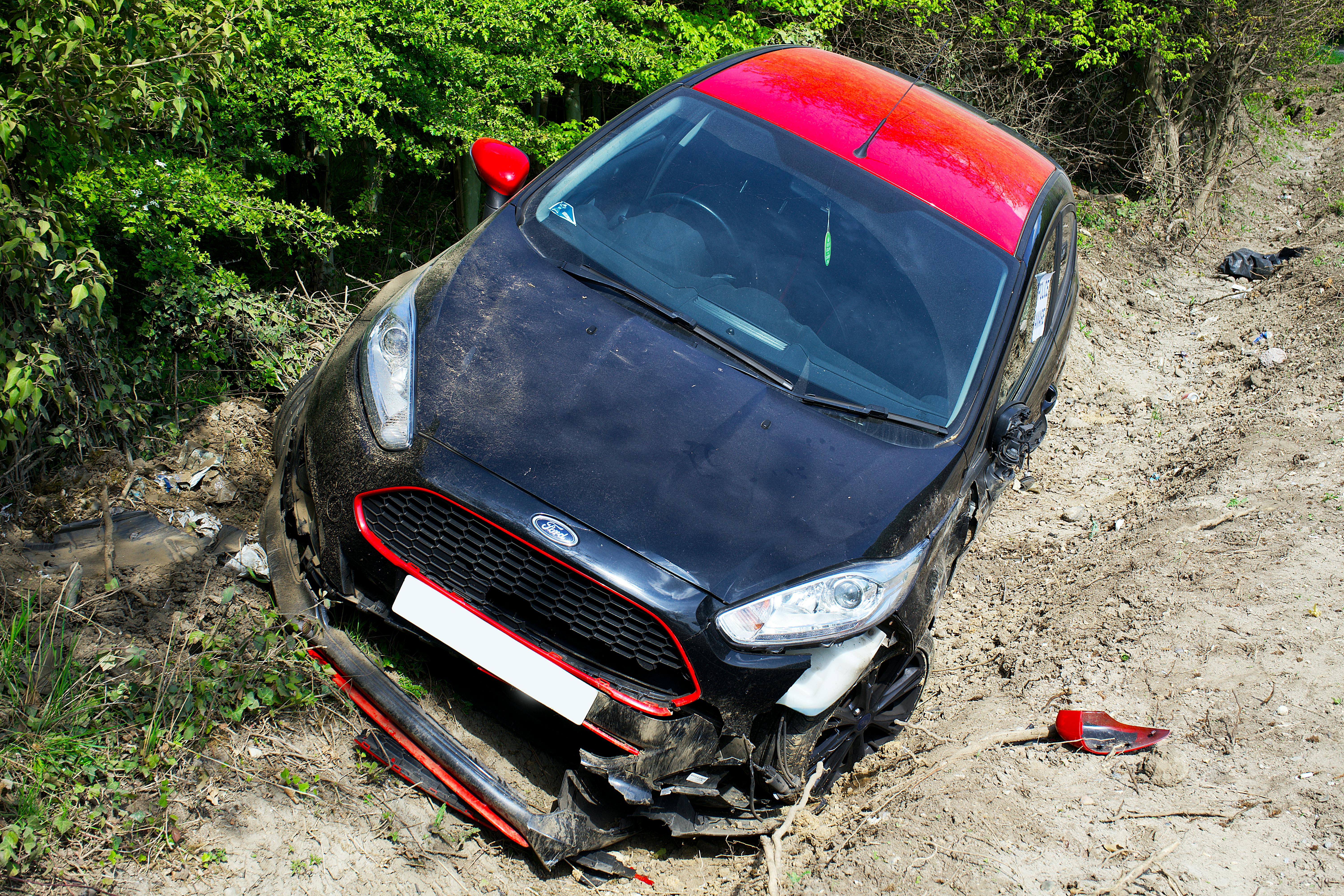 Crashed car on side of road