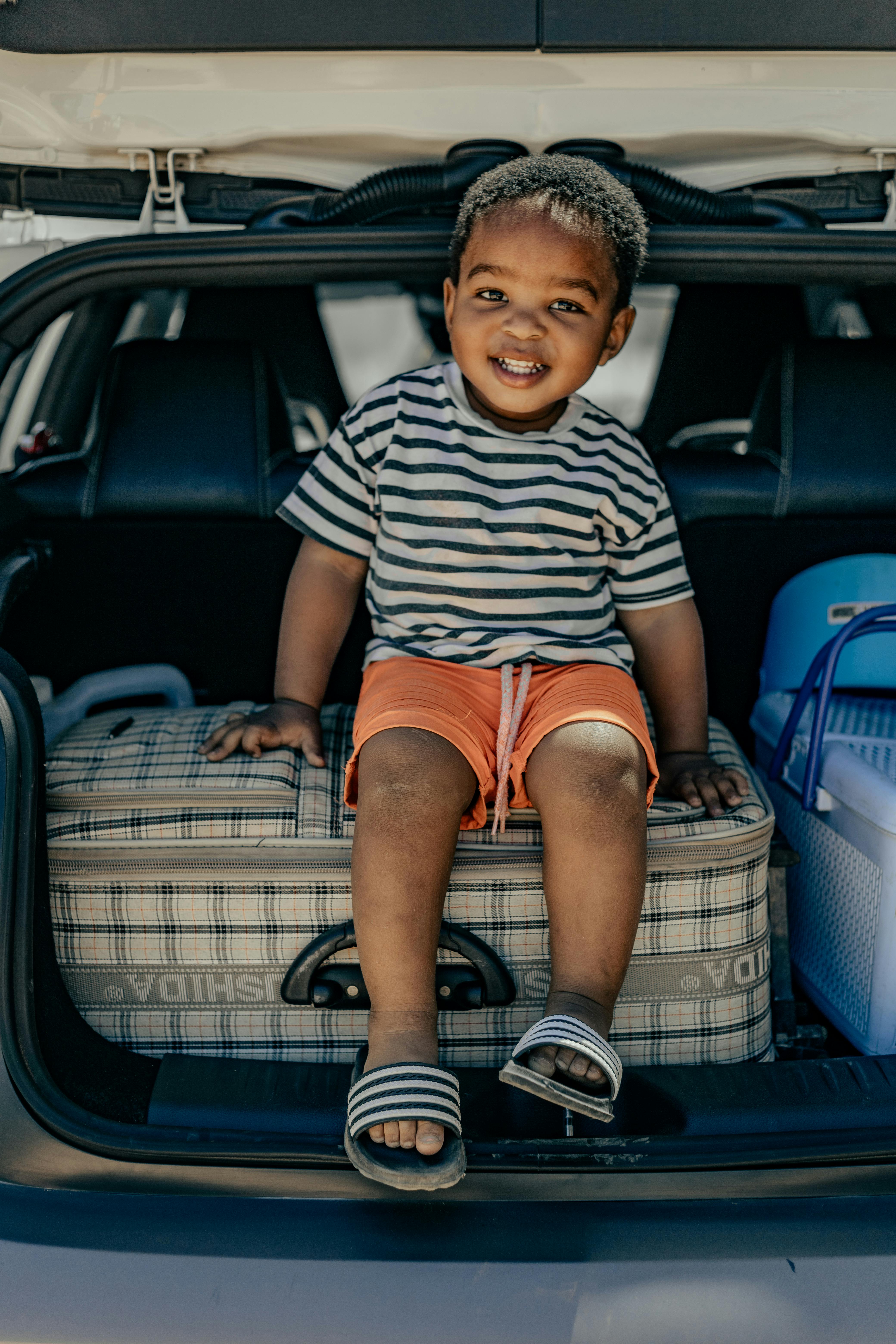 Child in load space of car