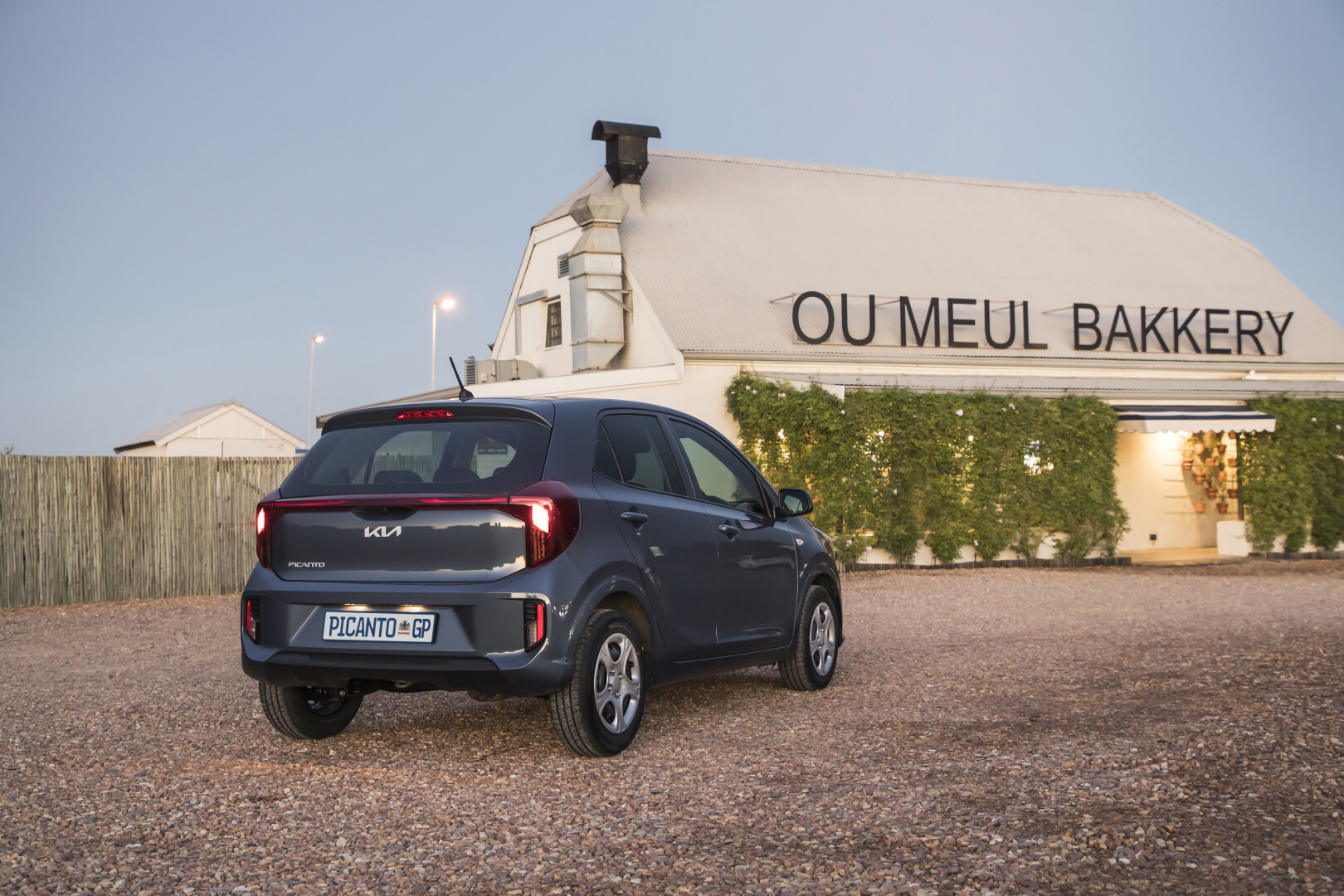 Rear view of the new Kia Picanto in front of the Ou Meul Bakkery