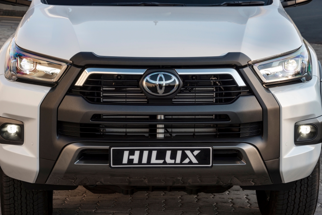 White Hilux agressive front grille and Toyota badge view