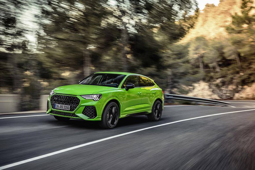 Image of a green Audi driving fast