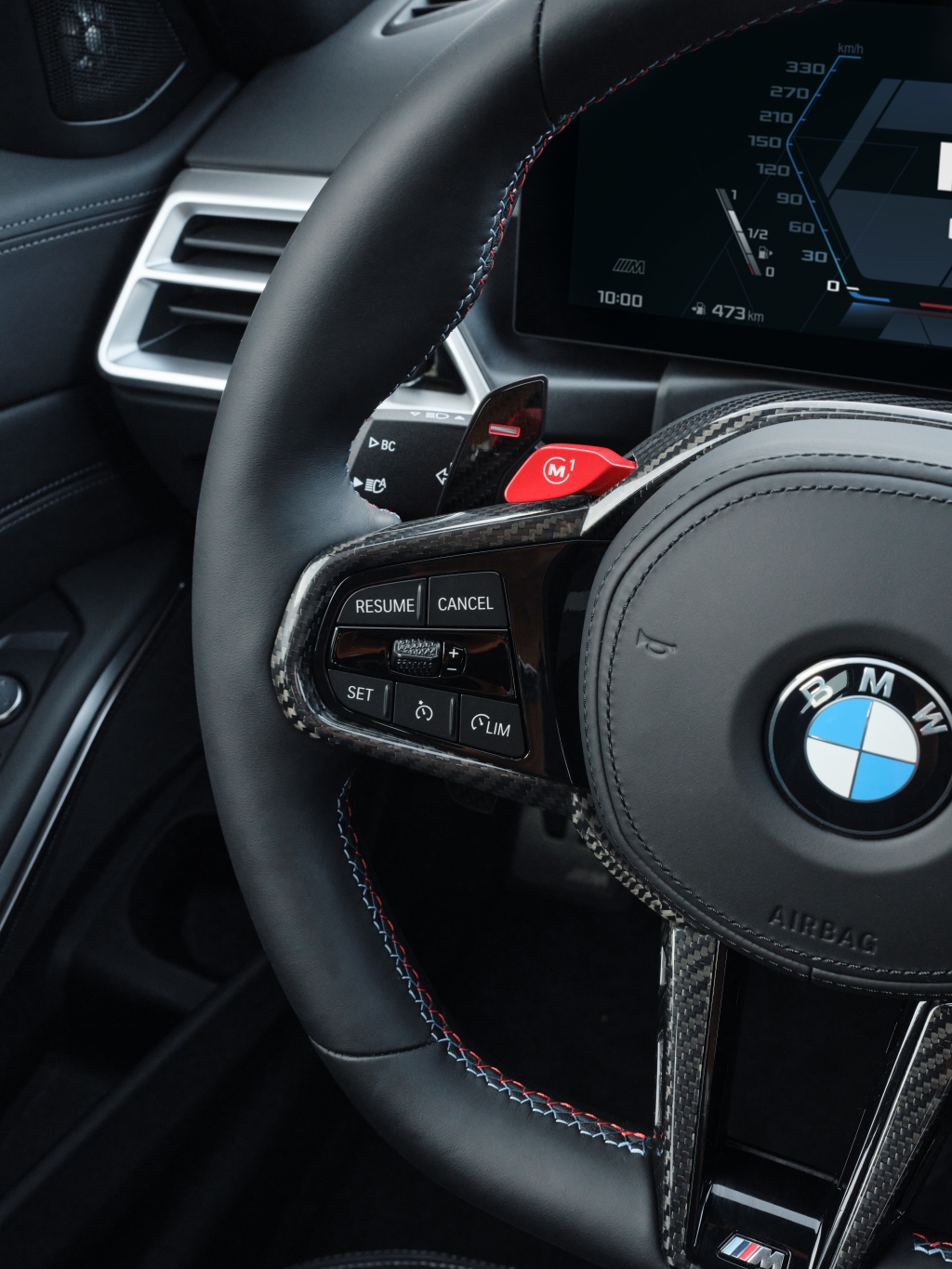 Carbon-fibre inserts in the redesigned steering wheel's spokes set the latest G80/82 BMW M3 Competition apart from its predecessor.
